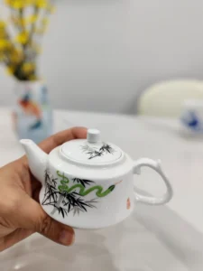 Teapot in a serene tea-setting context, emphasizing its decorative and functional use