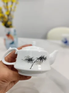 Hand-painted porcelain teapot with green bamboo and snake design, Jingdezhen ceramic craftsmanship